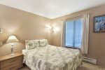 Guest Bedroom has a Queen Bed and Large Mirrored Closet